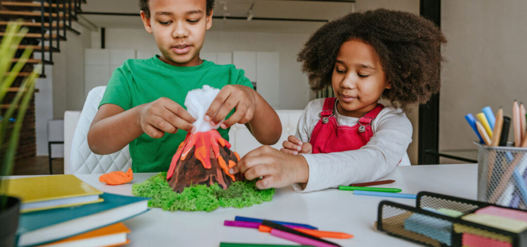 children working together to create a science project using tactile learning