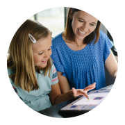 Mother and daughter learning together on an Ipad. 